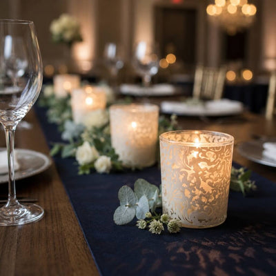 White lace votive candle holders glowing on elegant floral dinner table decor - thumbnail number 6