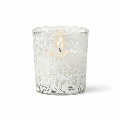White lace design votive candle holder with lit candle on white background - thumbnail number 3