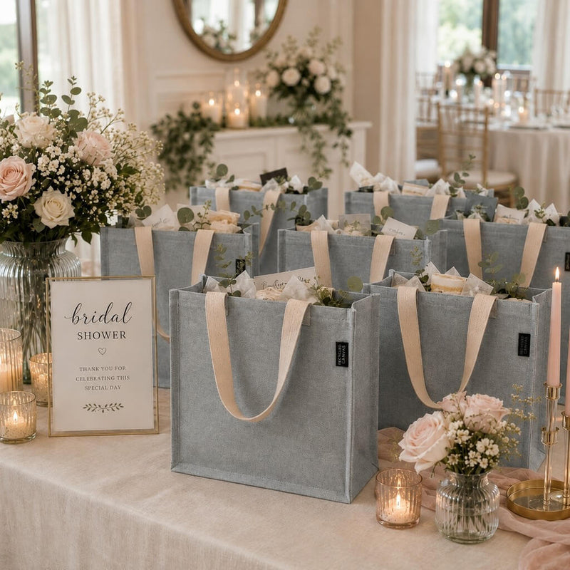 Gray canvas tote bags arranged on a table with a bridal shower sign and floral decor - thumbnail number 4