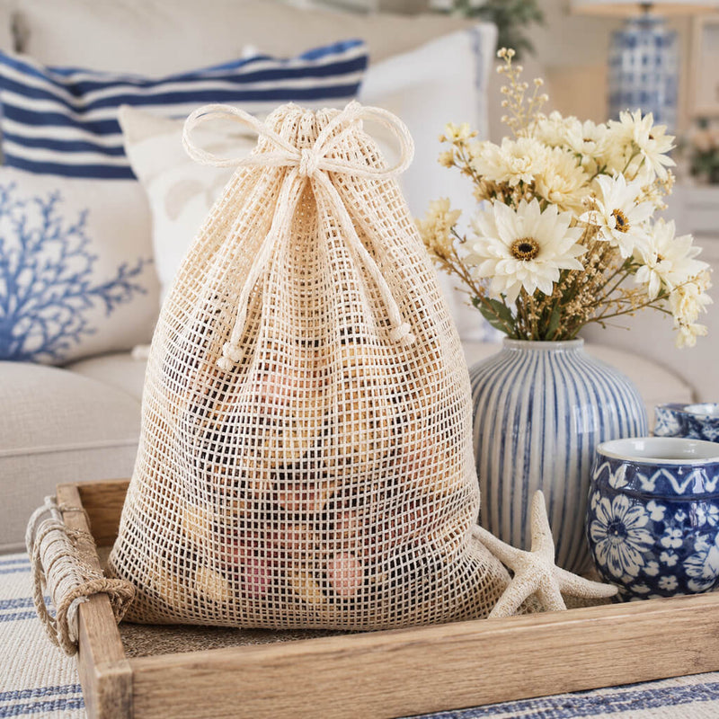 Natural cotton net drawstring bag filled with potatoes on a wooden tray - thumbnail number 7
