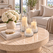 Glass candle holders filled with faux pearl beads surrounding lit candles on a table - thumbnail number 11