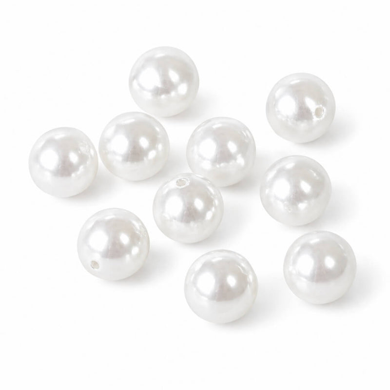 A close-up of ten 10mm glossy white faux pearl beads with visible holes - thumbnail number 1