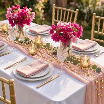 Gold faux pearl string beads draped along a pink table runner - thumbnail number 6