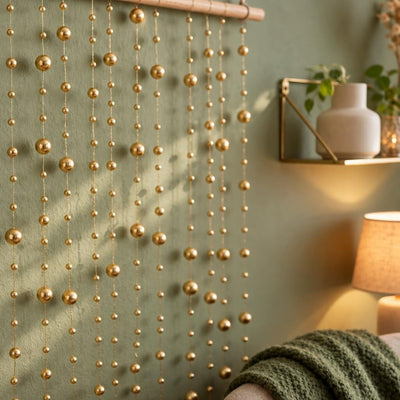 Hanging gold faux pearl string beads used as a decorative wall backdrop - thumbnail number 7