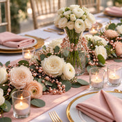 Rose gold faux pearl string beads wrapped around a centerpiece vase with white flowers - thumbnail number 2