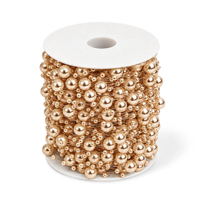 Spool of rose gold faux pearl string beads on a transparent fishing line - thumbnail number 1