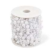 Spool of white faux pearl string beads on a transparent fishing line - thumbnail number 1