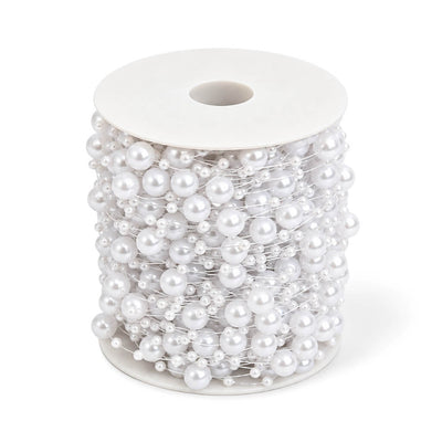 Spool of white faux pearl string beads on a transparent fishing line - thumbnail number 1
