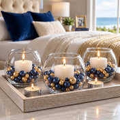 Three glass bowl vases with lit candles surrounded by navy blue and gold pearls on a tray - thumbnail number 8