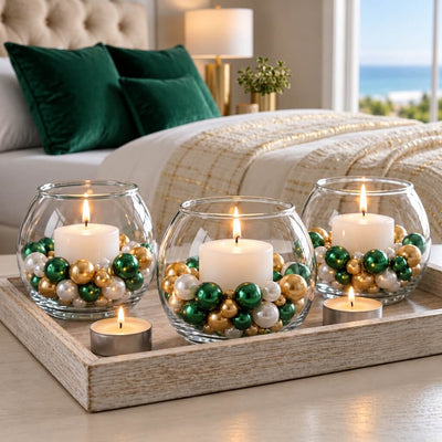 Three glass bowl vases with lit candles surrounded by green, gold, and white pearls on a tray - thumbnail number 6