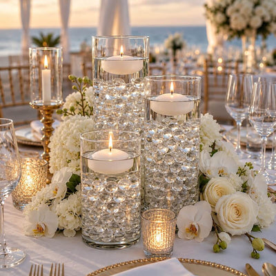 Glass vases filled with clear water gel beads and floating candles - thumbnail number 4