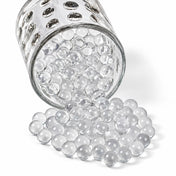A glass jar spilling clear water gel beads - thumbnail number 1