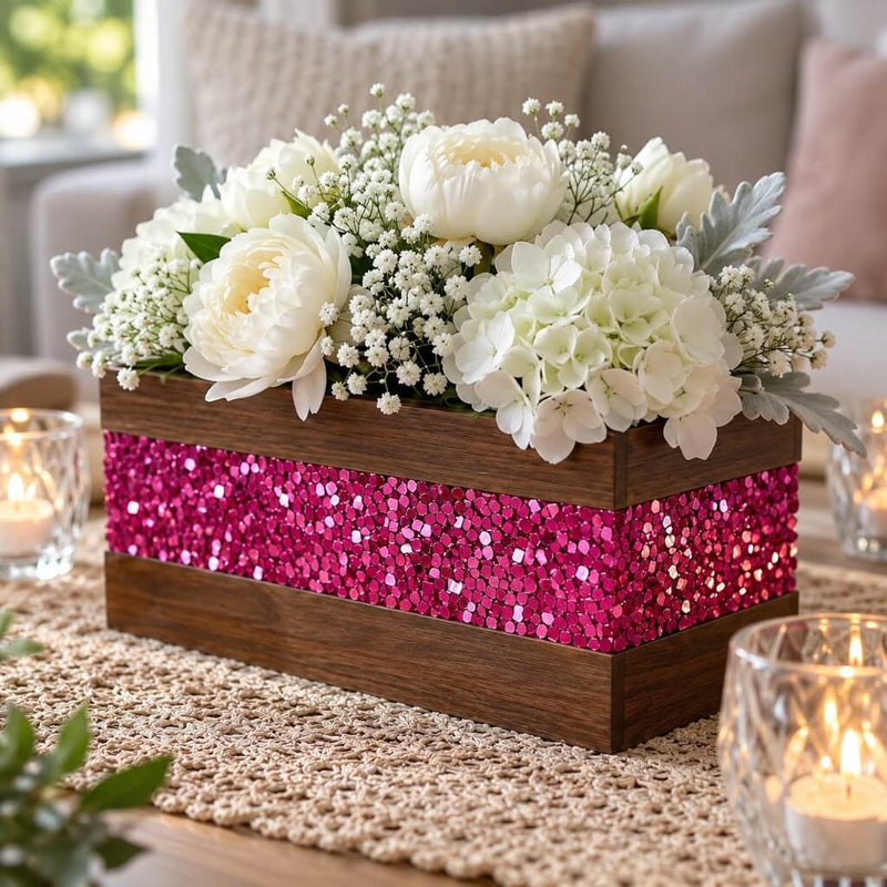 A wooden centerpiece box, accented with metallic hot pink chunky glitter, holding white flowers - thumbnail number 11