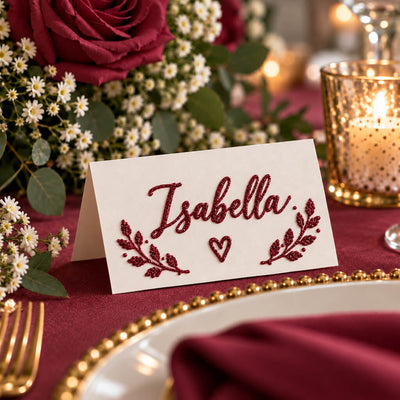 Place card with burgundy glitter calligraphy reading Isabella on a festive table setting - thumbnail number 4