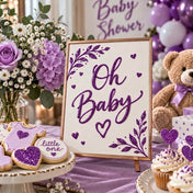 Baby shower sign with purple glitter lettering, surrounded by themed treats and decor - thumbnail number 7