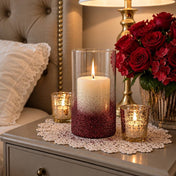 Glass cylinder candle holder decorated with metallic burgundy glitter on a bedside table - thumbnail number 8