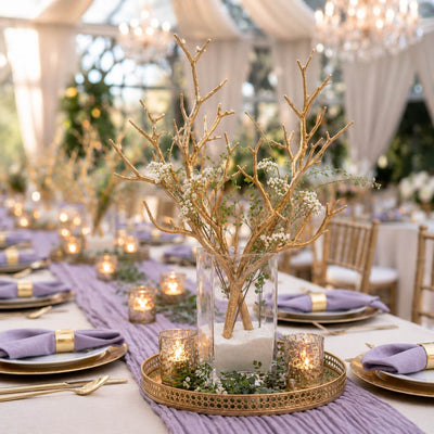 Metallic gold manzanita branches with white flowers in a sand-filled glass vase centerpiece - thumbnail number 5
