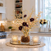 Metallic gold artificial manzanita tree branches arranged with dark flowers in a glass vase - thumbnail number 7