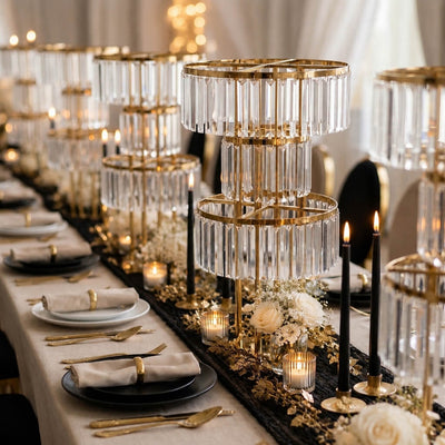 3-tier gold crystal pendant chandeliers with candles decorating a reception table - thumbnail number 3