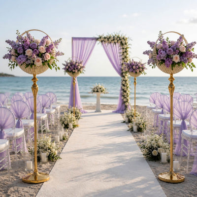 Gold metal candle holder stands decorating a beach wedding ceremony aisle - thumbnail number 5