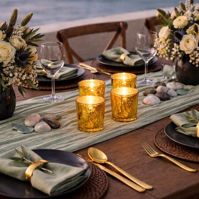 Four Gold Mercury Votive Holders on a coastal table runner with elegant sage green settings - thumbnail number 6
