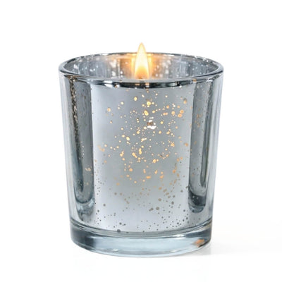 A single lit candle burning inside a Metallic Silver Mercury Votive Holder on a white surface - thumbnail number 2
