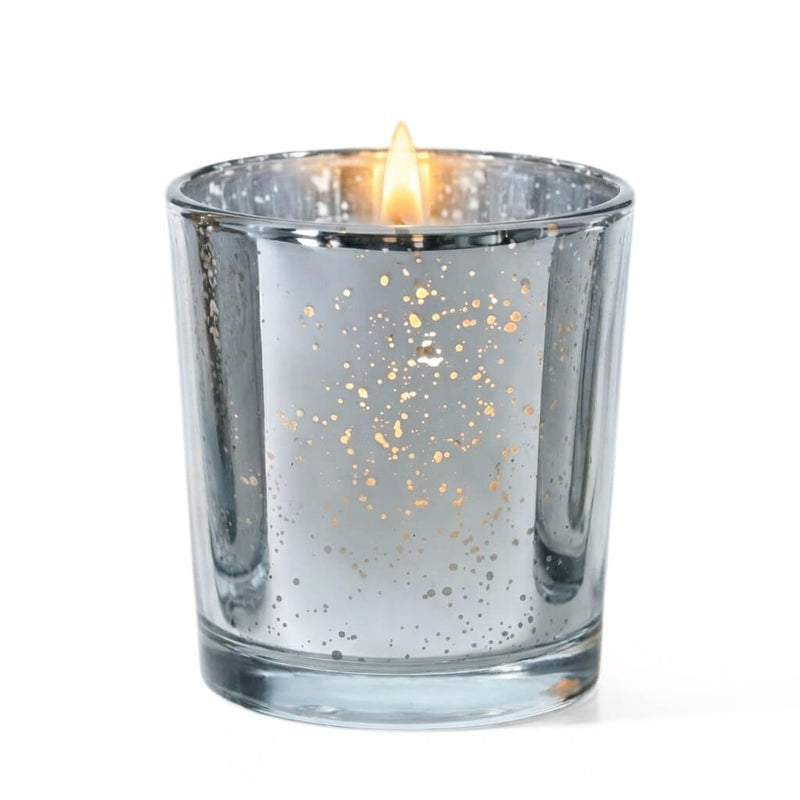 A single lit candle burning inside a Metallic Silver Mercury Votive Holder on a white surface - thumbnail number 2