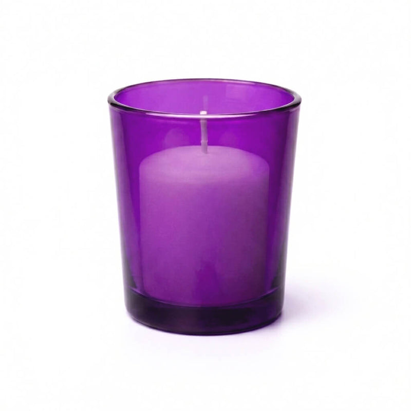 White unscented candle in purple glass votive holder - thumbnail number 1