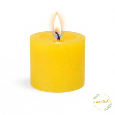 A lit yellow lemon meringue scented candle on a white background with a scented logo sticker - thumbnail number 4
