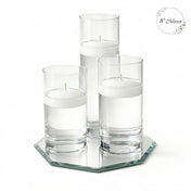 White floating candles in tall glass holders on a 8-inch mirrored tray - thumbnail number 1