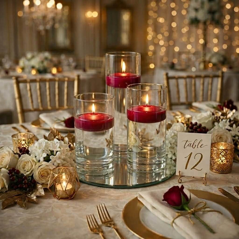 Wedding table centerpiece with three red floating candles and table number twelve - thumbnail number 3