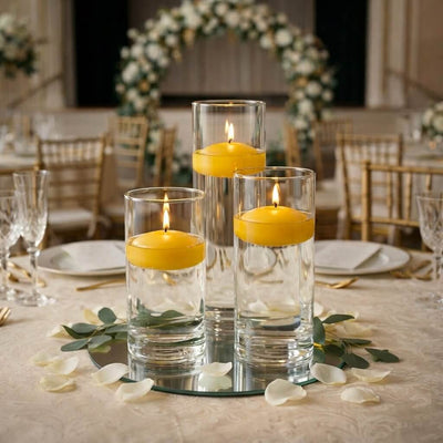 Wedding table centerpiece with three floating candles in glass cylinders - thumbnail number 7