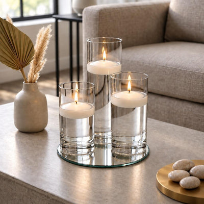 Three lit floating candles in glass cylinder vases on a round mirror tray - thumbnail number 8