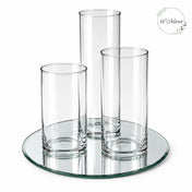 Three empty glass cylinder vases arranged on a round mirror tray - thumbnail number 1