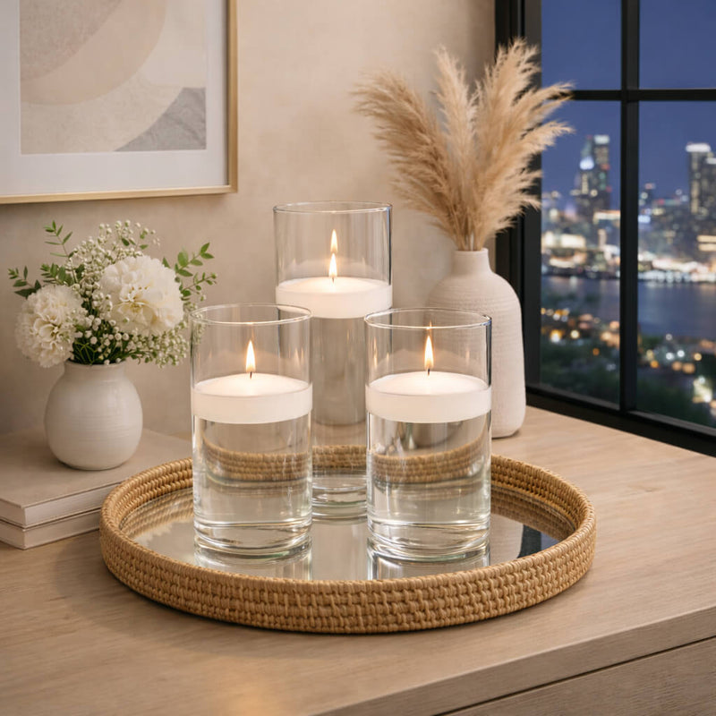 White floating candles in glass cylinders on a woven mirror tray with decor - thumbnail number 7