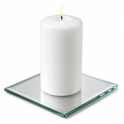 A 5" Square Mirror Coaster holding a lit white pillar candle isolated on a white background - thumbnail number 3