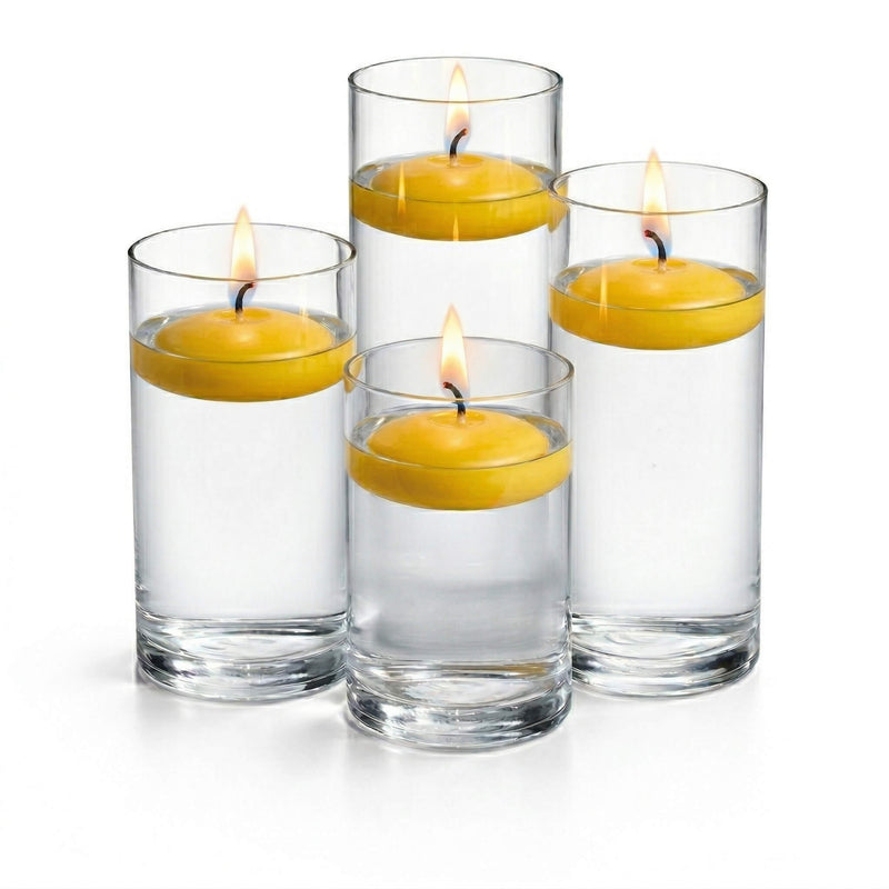 Four tall glass cylinder vases filled with water and lit yellow floating candles - thumbnail number 2
