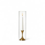 Lit white taper in a gold holder with a 4" x 16" chimney glass candle shade - thumbnail number 3