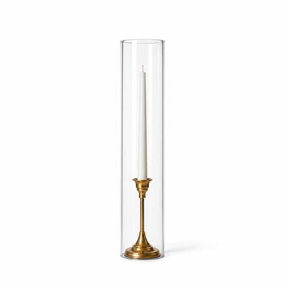 A white taper in a gold holder with a 4" x 18" chimney glass candle shade - thumbnail number 2