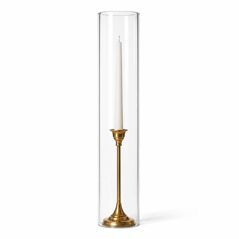 A white taper candle in a gold holder with a chimney glass candle shade on a white background - thumbnail number 2