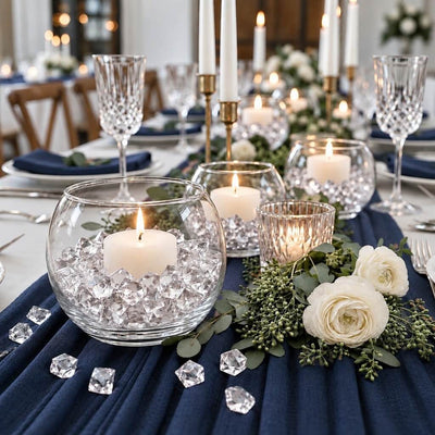 White candles in glass bowls filled with clear acrylic ice beads on a navy blue runner - thumbnail number 4