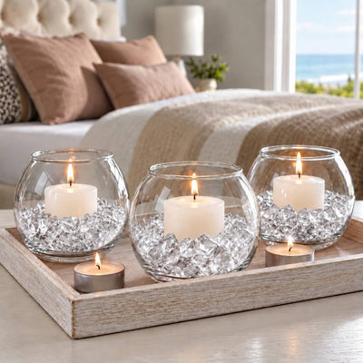 Lit candles in glass bowls filled with clear acrylic ice beads on a tray in a bedroom setting - thumbnail number 6