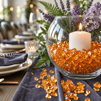 Orange acrylic ice beads fill a glass bowl vase with a candle and flowers - thumbnail number 2