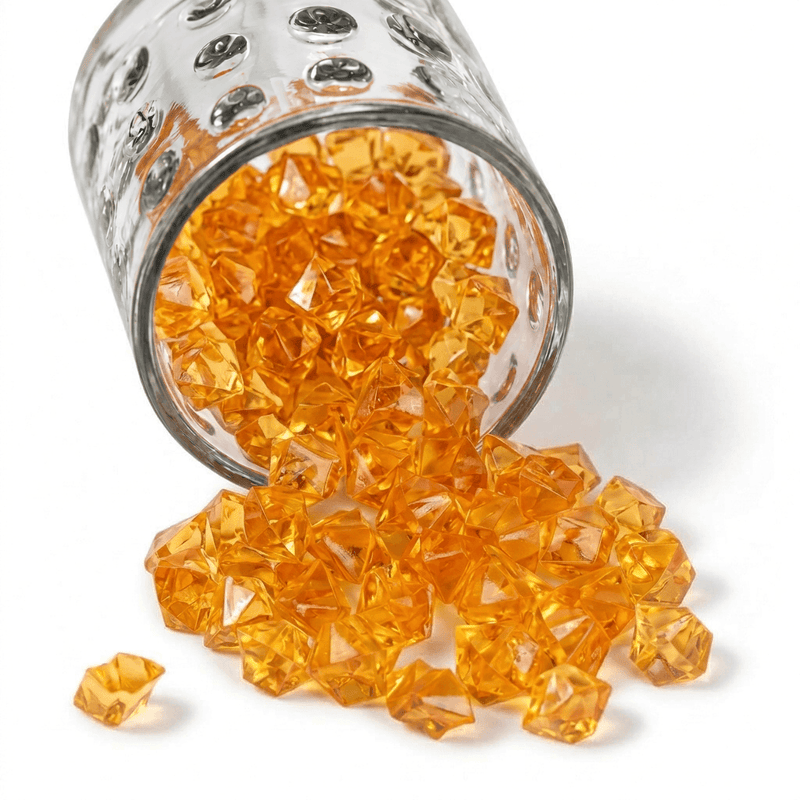 A glass jar spilling orange acrylic ice beads - thumbnail number 1
