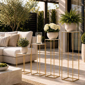 Four white acrylic square display stands with gold frames on a patio - thumbnail number 7