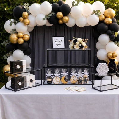 Multi-tiered clear acrylic and black metal display stands holding party favors and decorations - thumbnail number 4