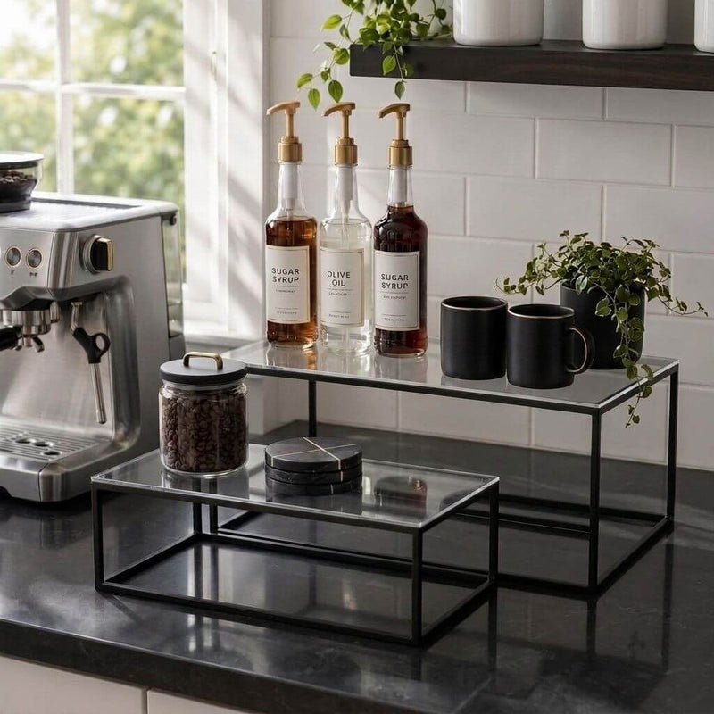 Clear acrylic and black metal display stands on a kitchen counter holding coffee bar accessories - thumbnail number 8