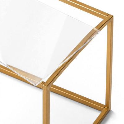 Close-up of a clear acrylic sheet resting on a gold metal rectangular display stand frame - thumbnail number 1