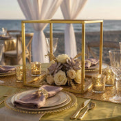 Gold square geometric frame centerpiece with flowers on a beach wedding table - thumbnail number 7