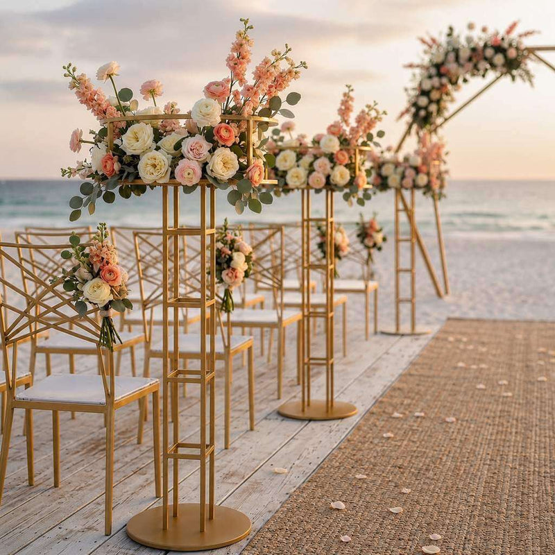 Gold metal floral risers lining a beach wedding aisle with peach and white flowers - thumbnail number 2